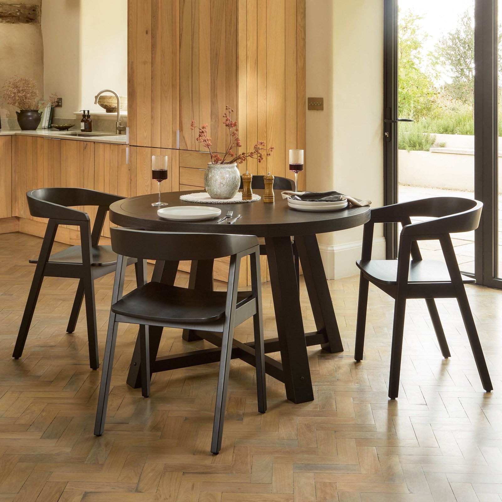 Charlotte Black Oak Round Dining Table Set - 4 Seater - Ella Black Dining Armchairs - Image 1