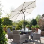 Kemble 4 Seater Rattan Round Dining Set with Cream LED Premium Parasol & Parasol Rain Cover - Grey Weave - Image 2