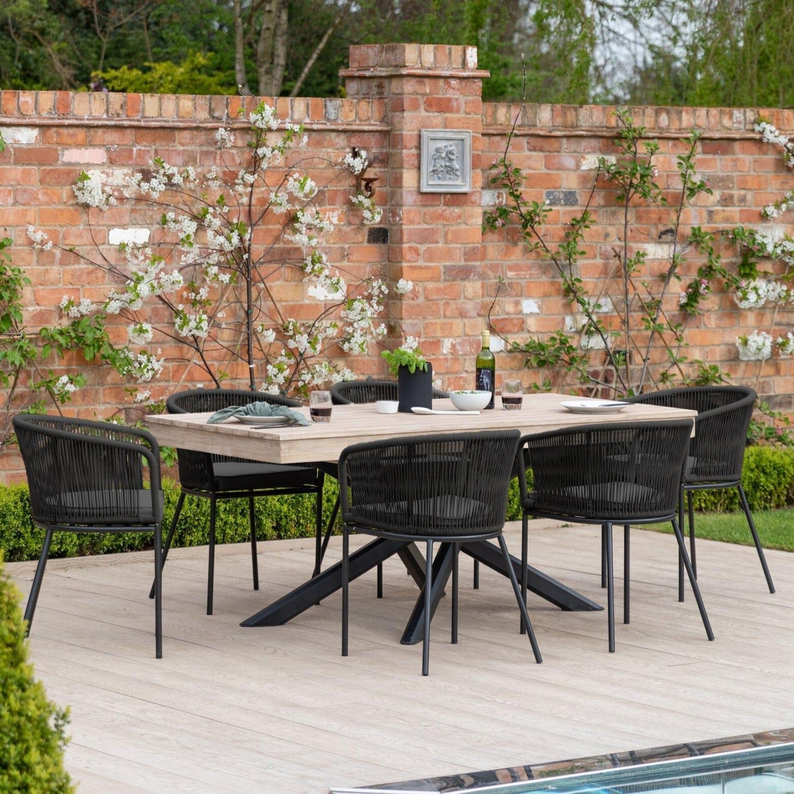 amelia-6-seater-whitewash-wood-black-legs-garden-dining-set-hali-black-chairs-laura-james-1 Amelia 6 Seater Wooden Garden Dining Set with 6 Hali Black Chairs - Light Brushed Acacia with Black Legs