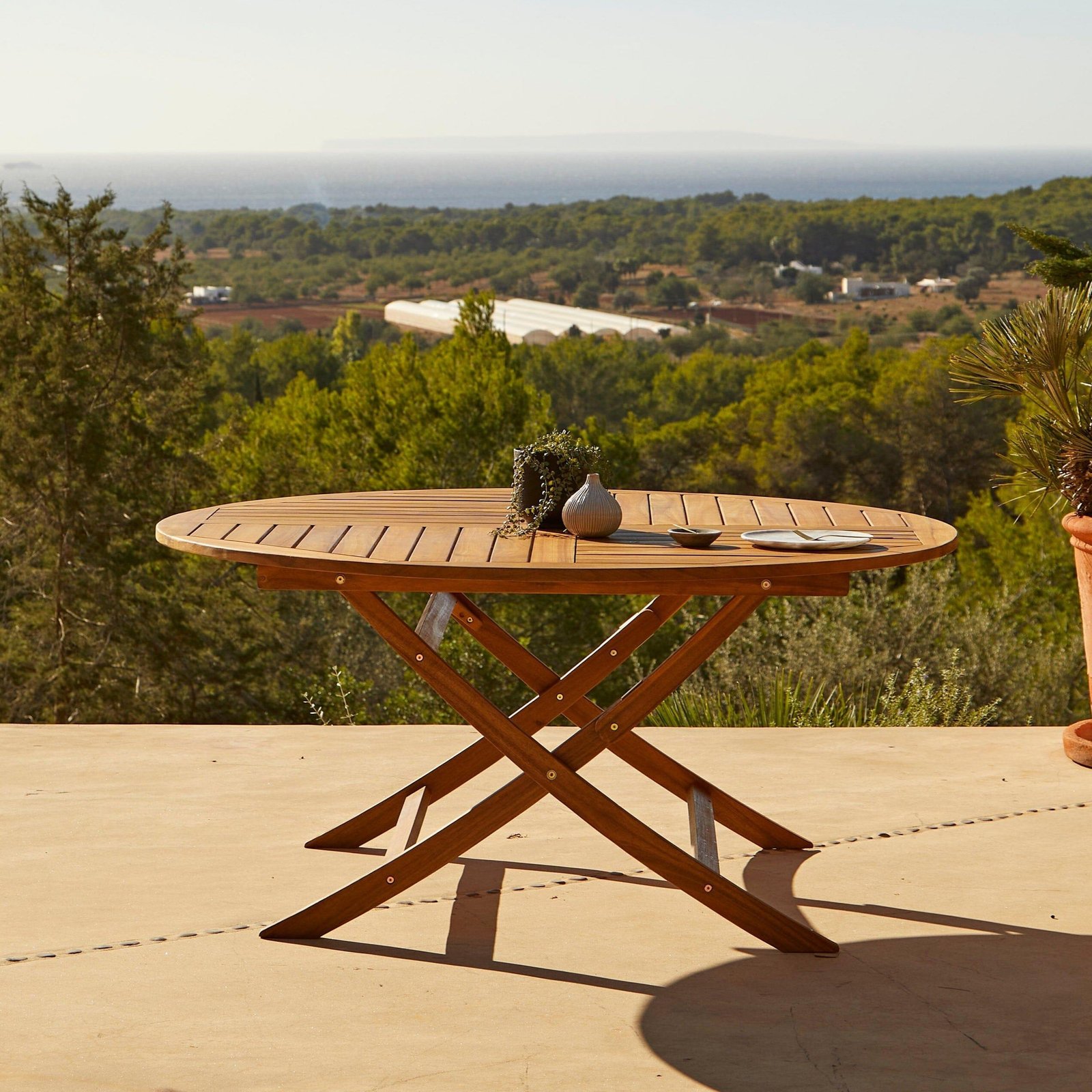 ashby-6-seater-wooden-round-folding-garden-dining-table-130cm-laura-james-1_cdd7cd76-9fb0-4b1a-92ab-9ce28116f3ee Ashby 6 Seater Wooden Round Folding Garden Dining Table - 130cm