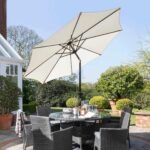 Kemble 6 Seater Rattan Round Dining Set with Cream LED Premium Parasol & Parasol Rain Cover - Grey - Image 5