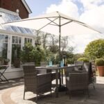 Marston 6 Seater Rattan Garden Dining Set with Cream LED Premium Parasol - Grey - Glass Top - Image 2